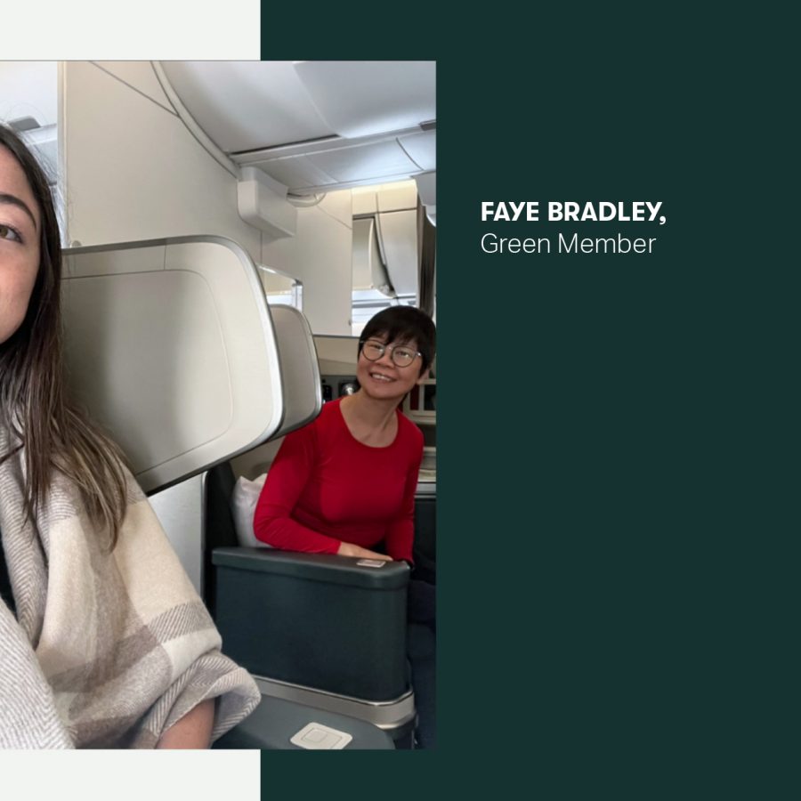 Two smiling women sat in business on board a Cathay Pacific flight